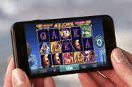Picture of a smartphone with a mobile video slot on the screen